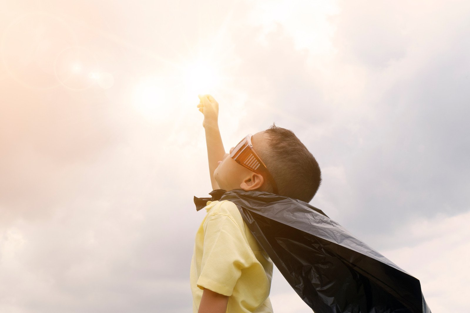 a boy with wings like batman ready to fly 